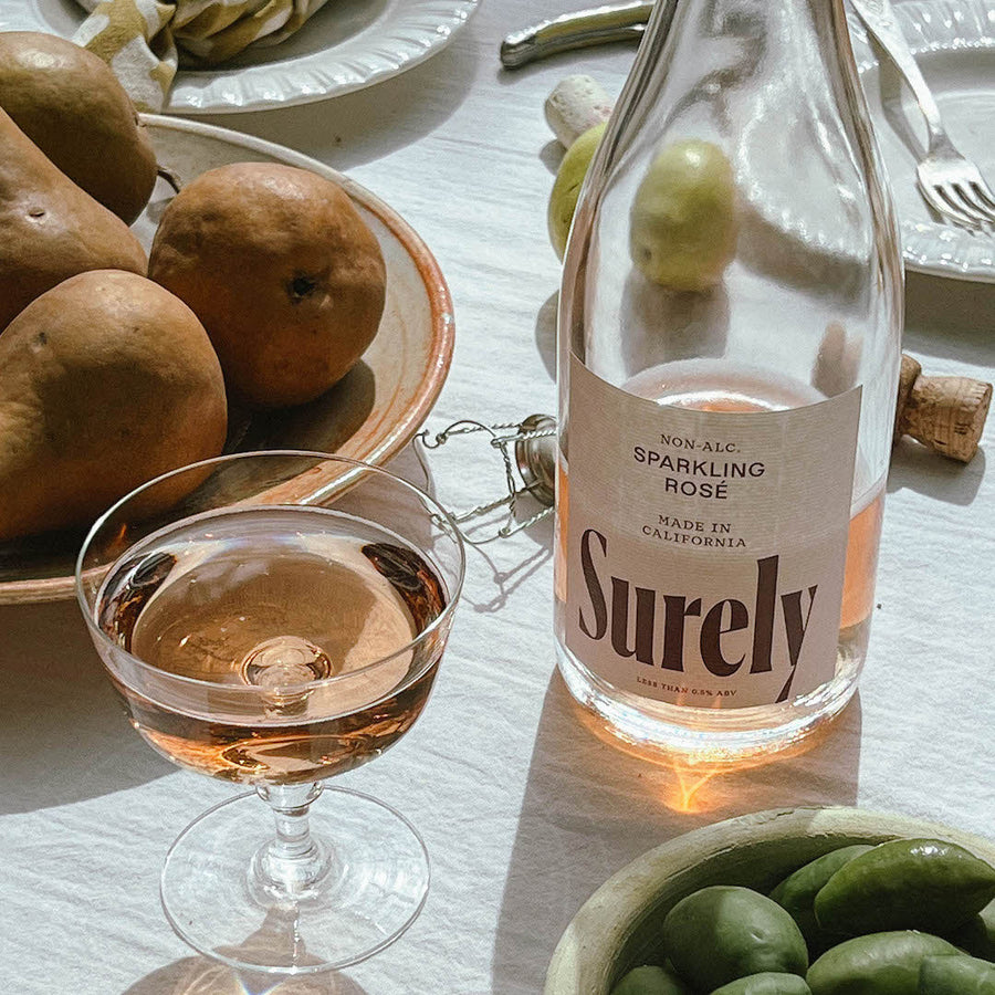 Non-alcoholic Sparkling Rosé Surely Glass on Table
